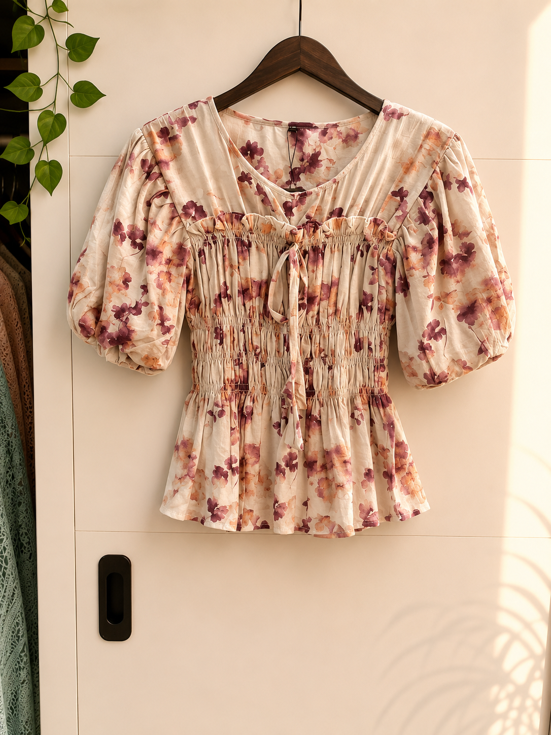 file_00000000193482119d6eb5b43f416c64 Floral smocked peplum top - Image 1